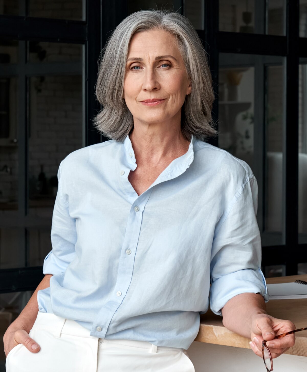 Nashville cheek implant model with blue shirt