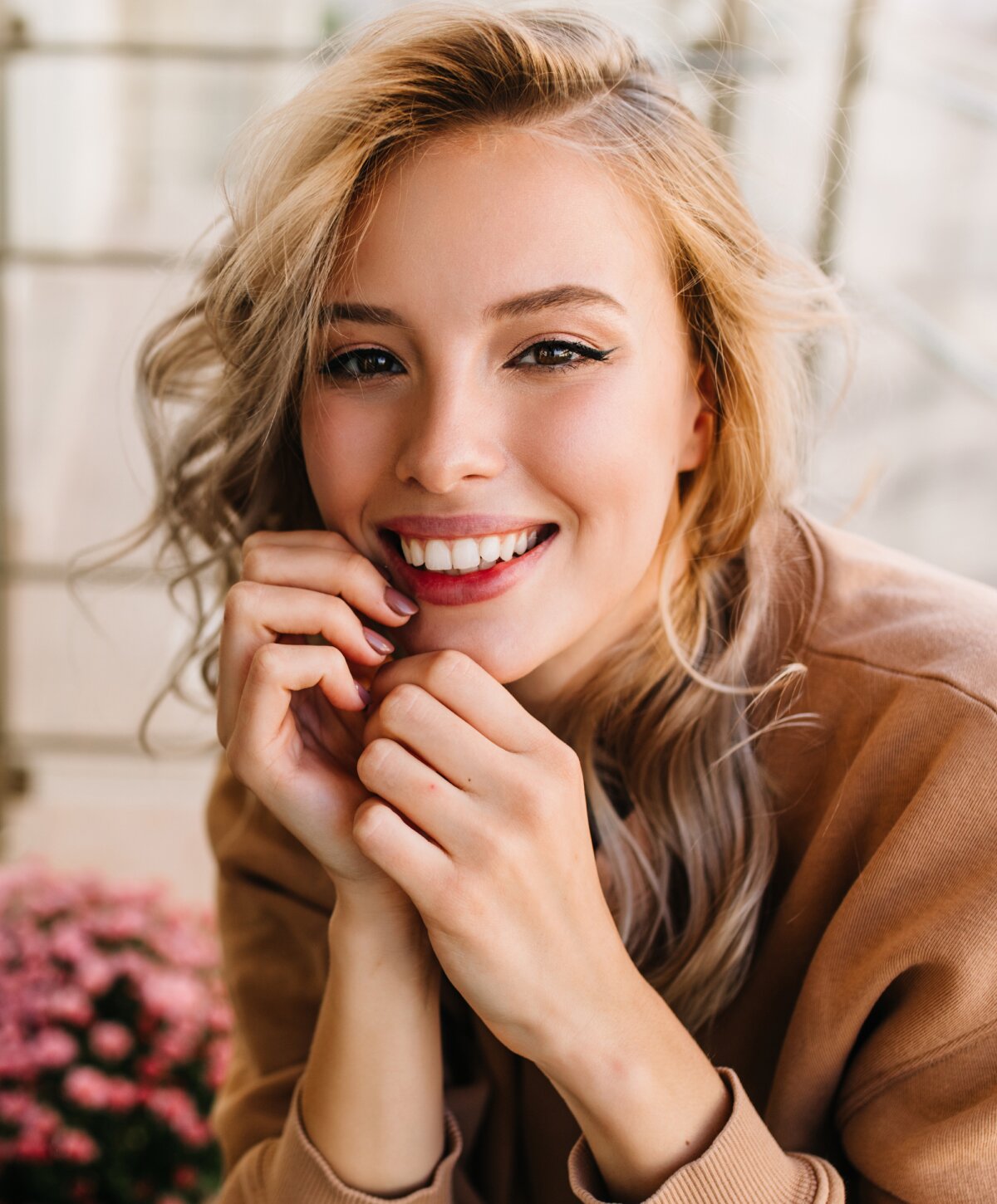 Nashville non-surgical rhinoplasty model with blonde hair smiling